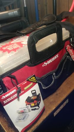 New husky 16 inch tool bag with pull up handles and comes with 4 plastic totes