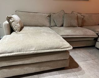 Sofa with cushions and ottoman