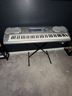 Casio WK-3000 digital keyboard with stand