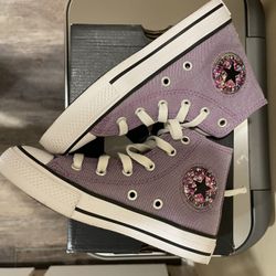 Purple high top Converse shoes.  Glitter on the Converse star.  Size 12 youth.