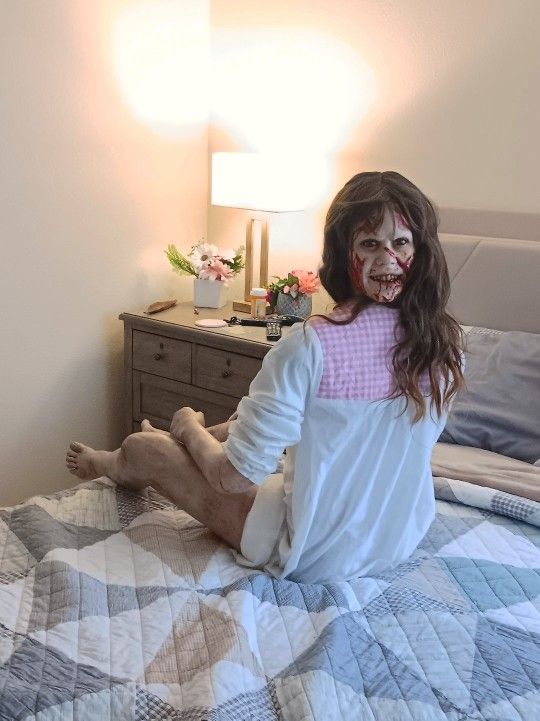Hyper realistic lifesized bloody Regan prop from iconic The Exorcist scene.