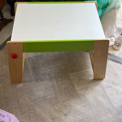 Gape Play Station And Stool Chair Set Is  From Sturdy Wood With A White Top And Green Accents 