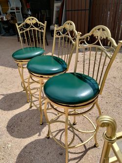 3 swivel golden barstools