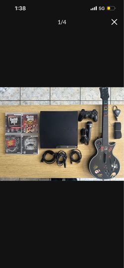 PS3 with controller guitar mic and games