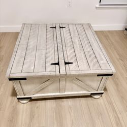 Double lift-top coffee table with storage. Both sides lift up.  