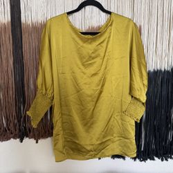 Yellow/gold silk-like blouse with puffy 3/4 sleeves and elastic cuffs; perfect condition