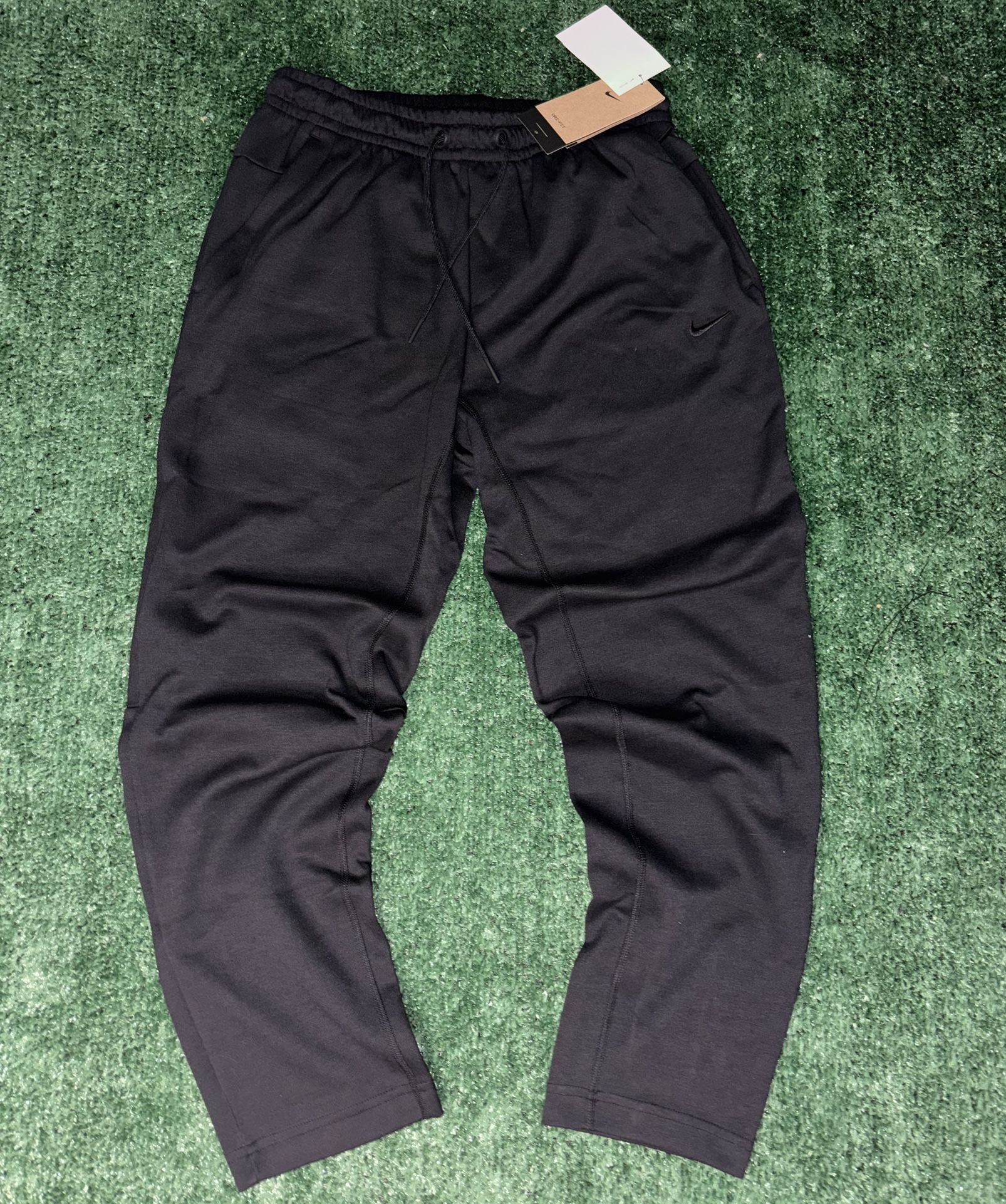 Black Nike Dri-Fit joggers - soft and lightweight with zipper pockets