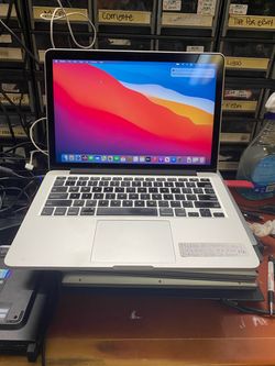 Silver MacBook Pro Retina 13-inch, Early 2015, laptop 💻 i5 2.7GHz, 8GB RAM, 128GB SSD, running macOS Big Sur. Powers on and boots to desktop.
