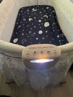 Delta Children Baby Bassinet with Light and Sound
