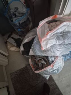 Assorted baby clothes with some toddler clothes