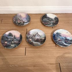 Thomas Kinkade's Enchanted Cottages series, produced by Edwin Knowles. 