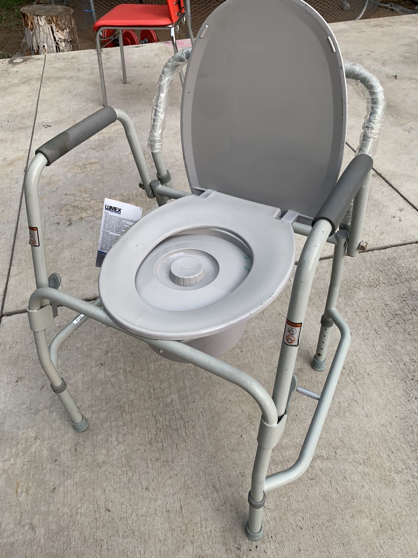Bed side toilet seat for handicap or disabled person