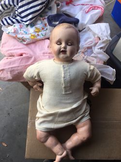 Vintage or antique doll. Bisque face eyes open and close