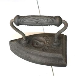 Antique Flat / Sad Iron made of Cast Iron. Curved stamped handle.