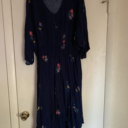Lady’s Blue Dress With Flowers 