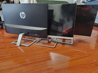 3 computer monitors