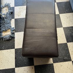 Brown leather ottoman