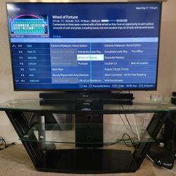 Used, 55 inch Samsung  SUHD TV  with tempered glass tv stand  $350