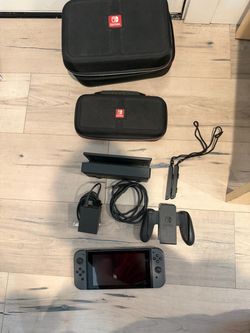 Nintendo Switch regular with all accessories and cases