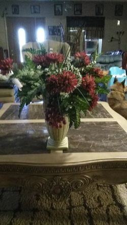 Artificial red flowers with vase