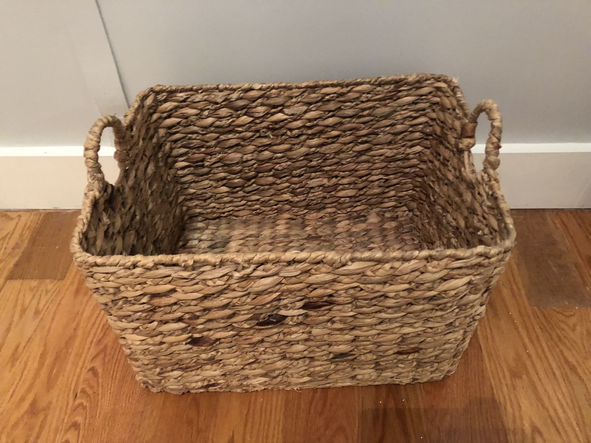 Woven wicker basket with handles