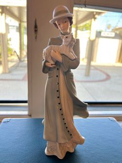 Porcelain Woman with Dog Figurine
