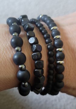 Black beaded stretch bracelets, wooden, new. $2 each
