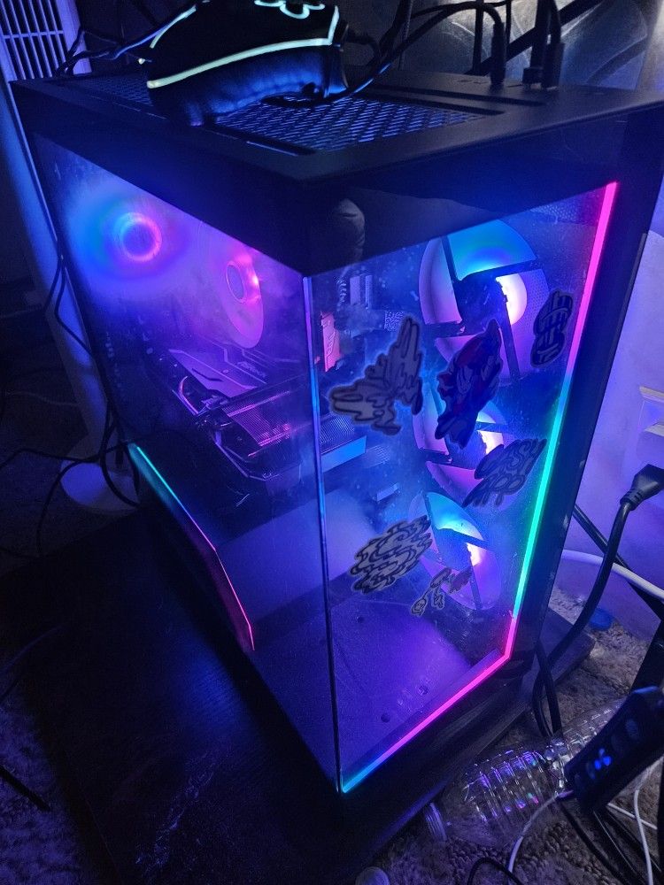 Gaming Pc With A Curved Ultrawide Monitor And Keyboard And Mouse.