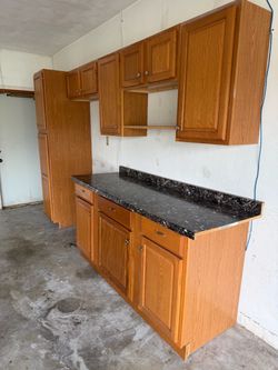 Oak Kitchen Cabinet Set with Dark Countertop