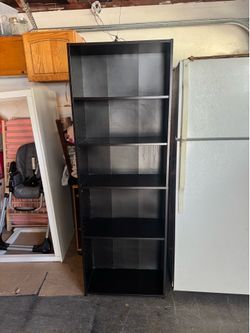 Dark brown 11 1/2 “ 5 -layer shelf wood bookcase . 11 1/2 deep x 25W x 71 1/2H .