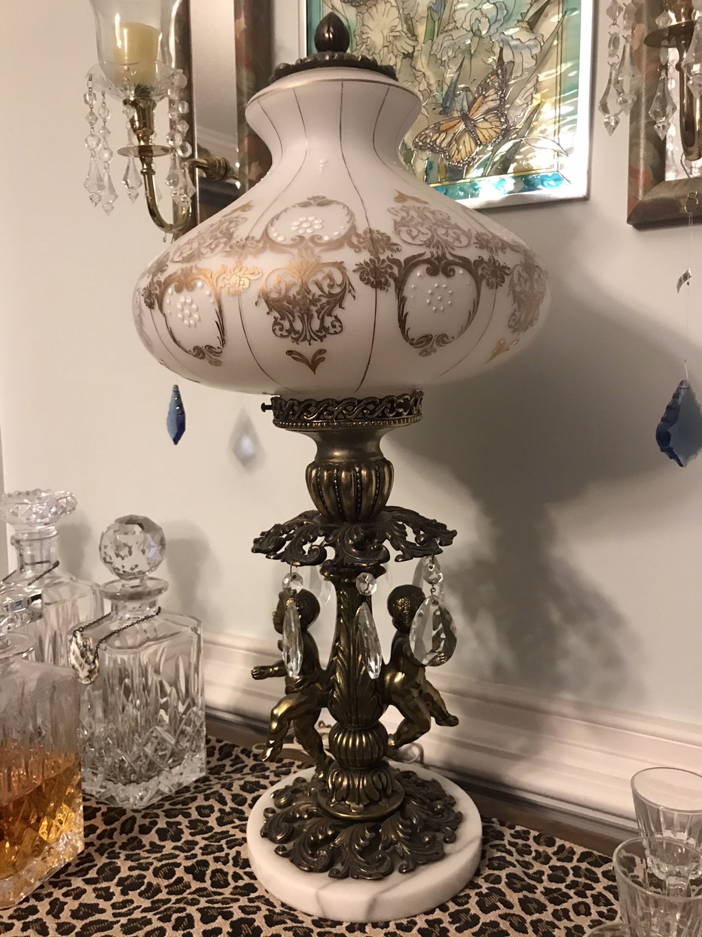 Antique marble base cherub lamp with white milk glass globe and gold trim