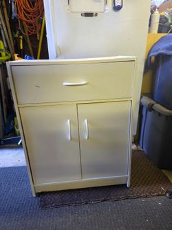 Handy white storage cabinet 
24.25"w x 12"d x 31.5"h