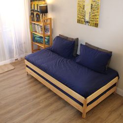 Stackable IKEA "Utaker" twin bed frames with twin mattresses