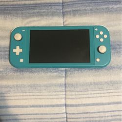 Nintendo Switch Lite (Very lightly used)