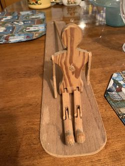 Vintage folk art wood dancing man with stick and platform