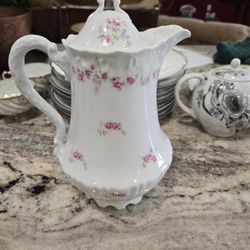 Antique tea cups and pitchers