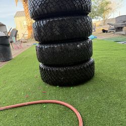 Toyota Truck 4 Tires One Is Scratch Up From The Rims But The Tires Are In Good Condition And They Are Filled Up With Air Already 
