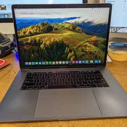 Apple MacBook Pro 15" 2019 Touchbar 8 Core i9 32gb 512GB SSD Dual GPU

