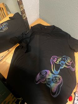 short-sleeve t-shirt featuring a colorful, iridescent dual-controller graphic print on the lower fron
