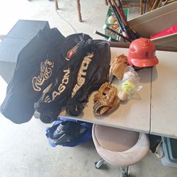 Baseball bags gloves and balls and Helmet.