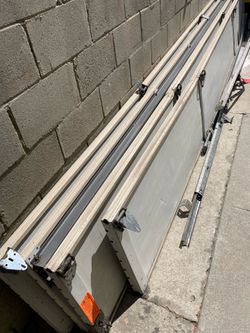 Garage door 7’ h by 15’ l