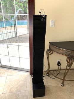 Water fall tower indoor with projecting light multicolored