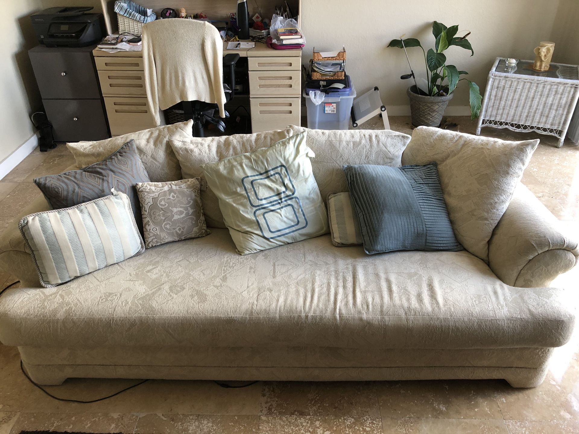 Off-white couch and love seat
