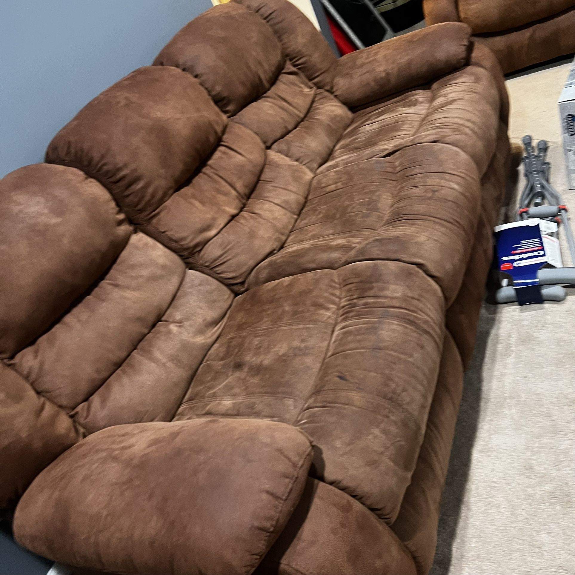 Faux Leather Recliner Sofa – Great Condition –  $350.Description: Comfortable faux leather recliner sofa in excellent condition. Smooth recli