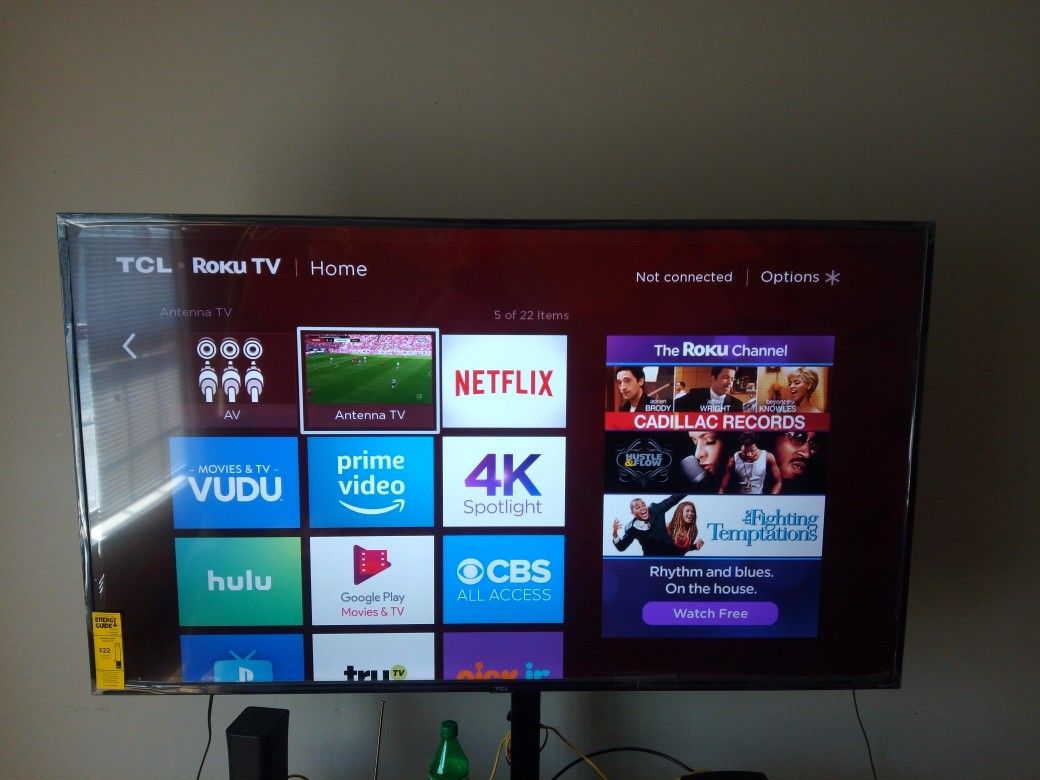 Gotta really nice 65 inch flat screen TCL ROKU TV an brand new TV STAND HOLDS UP TO 70 INCH