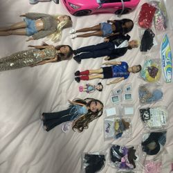 Barbie dolls, car, clothes, and accessories