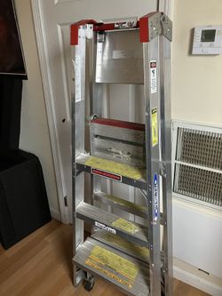 5 Foot metal ladder on wheels
