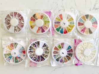 3D nail art pearls, rhinestones, and slices. DIY nail art