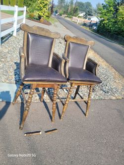 As is.    Pair of Vintage Wood Bar Stools with Arms
