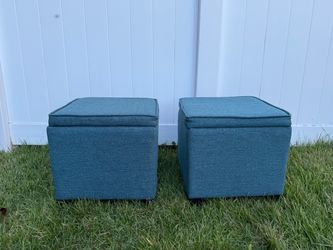 Two green fabric storage ottomans